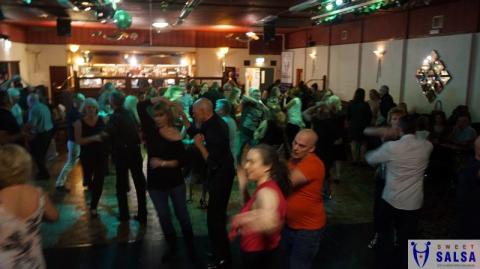 Many people dancing on a busy dance floor