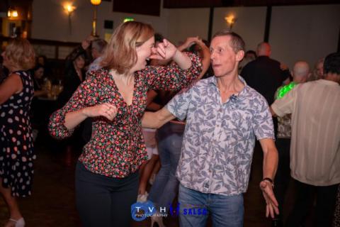 Two people dancing to salsa music