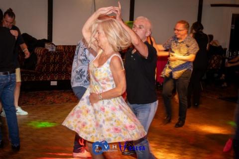 Two people dancing salsa at the Canberra Club
